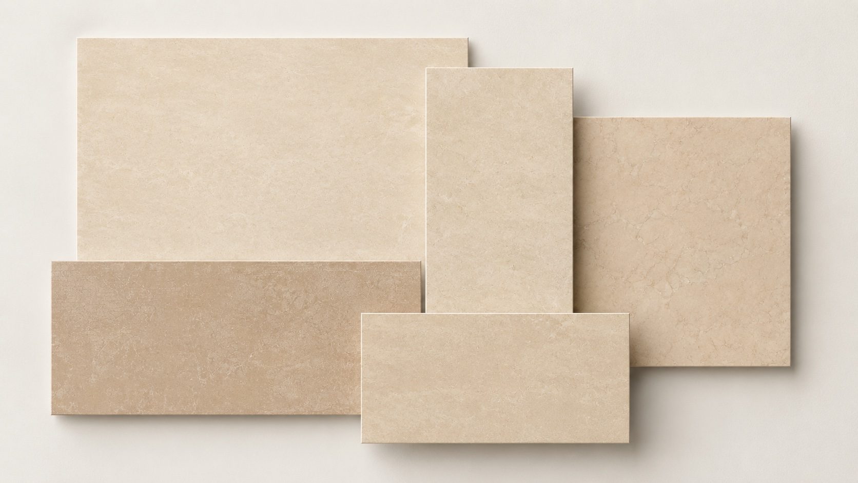 Artistic arrangement of rectangular stone tiles in varying sizes and earthy, neutral tones